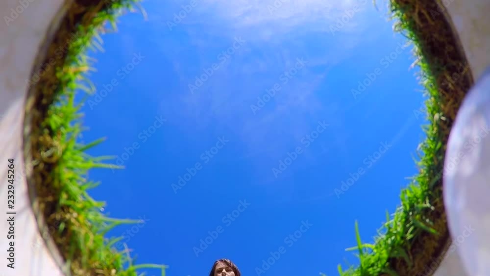 custom made wallpaper toronto digitalDirectly Below View on a Golfer Putting the Golf Ball in the Golf Hole and Golfer Picking Up the Ball from the Hole in a Sunny Day with Blue Sky.