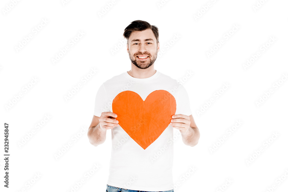 Handsome smiling man showing red big heart shape sign isolated on white Handsome smiling man showing red big heart shape sign isolated on white