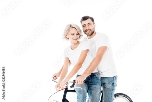 Wonderful couple riding bicycle together isolated on white