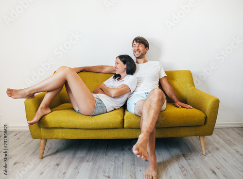 Smiling happy couple in love have fun relaxing at home
