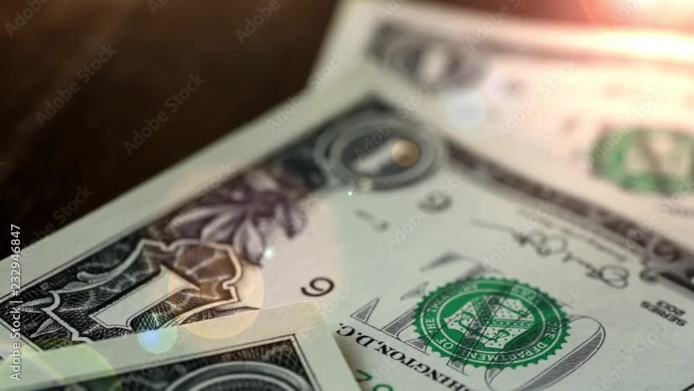 Dollar bills, money background. Dollars money lying on wooden table Portrait of George Washington closeup on the bills