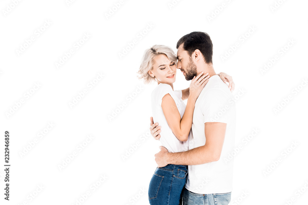 Happy young adult couple hugging isolated on white Happy young adult couple hugging isolated on white