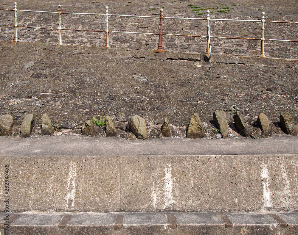 Rusted Ramp old concrete pedestrian ramps with rusting steel railings on the ...