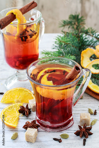 Christmas drink with spices and orange peel