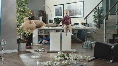 Little boy making a mess in the living room photo