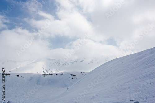Snow hill scene of tateyama mount in japan with blue sky