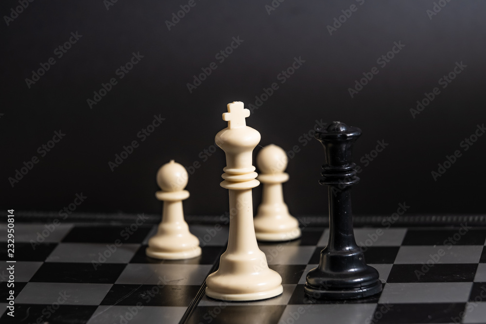Plastic chess closeup on a black background. A game Plastic chess closeup on a black background. A game