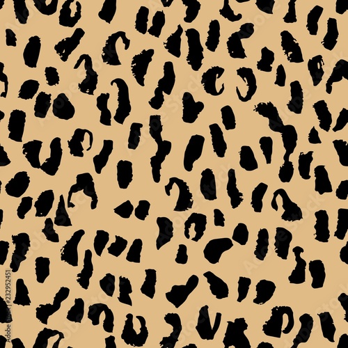Leopard seamless pattern, in beige and black colors. Hand drawn stylish fashion texture, background