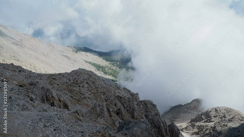 Fluffy cloud moving upon Tahtali mountain slope. Kemer, Turkey. Fluffy cloud moving upon Tahtali mountain slope. Kemer, Turkey.