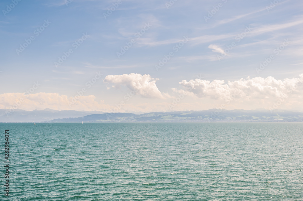 View of the Bodensee Lake (Lake Constance) from the side of the city of Friedrichshafen, Germany. Switzerland is on the opposite side of the lake