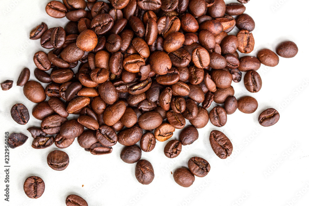 Roasted coffee beans isolated on a white background.