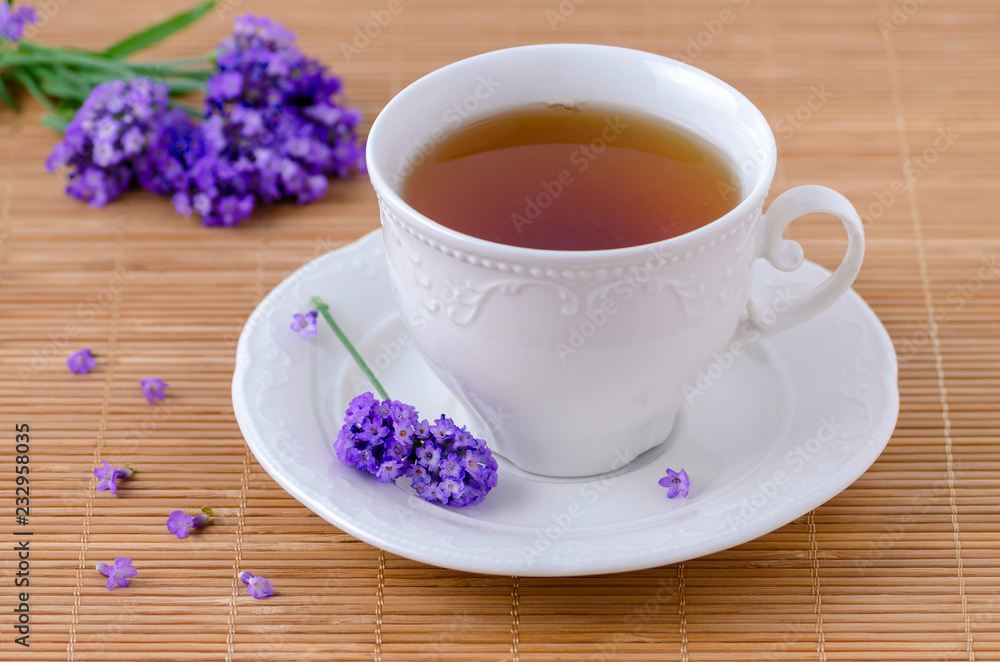 cup of healing tea with fresh lavender flowers, selective focus cup of healing tea with fresh lavender flowers, selective focus