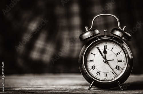 Retro alarm clock. Image in black and white color style