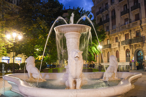 Fountain in a Plaza Jado square in Bilbao, at night photo