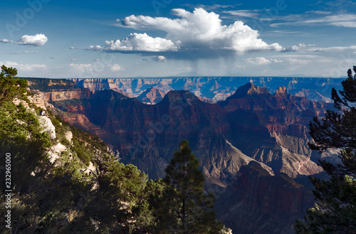 Two guys sitting on a rock enjoying the view of the Grand Canyon North Rim in Arizona © Manel Vinuesa