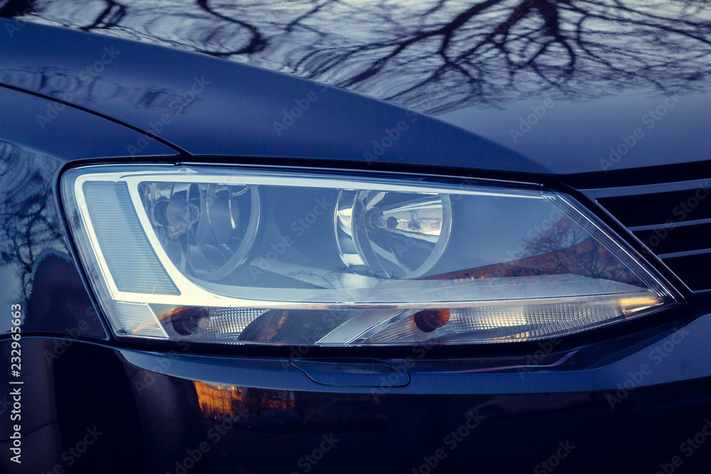The headlight of the car is black. Background for the desktop