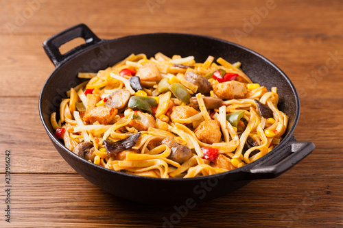 Indonesian pasta with chicken, pieces of bamboo and mushrooms.