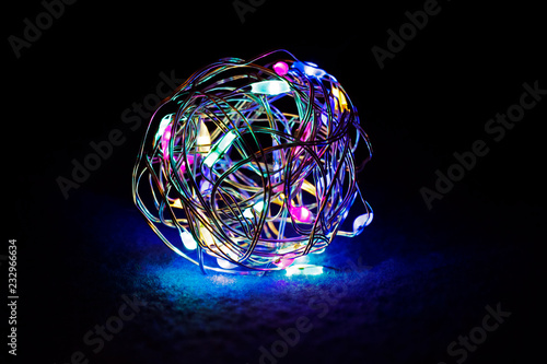 Ball from colorful led lamps at dark background photo