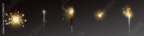 Vector festive sparklers set. Wind blows sparks, process of burning. Holiday element isolated on dark background. Realistic firework, bright glowing till smoldering. Flares with flames, fire closeup.