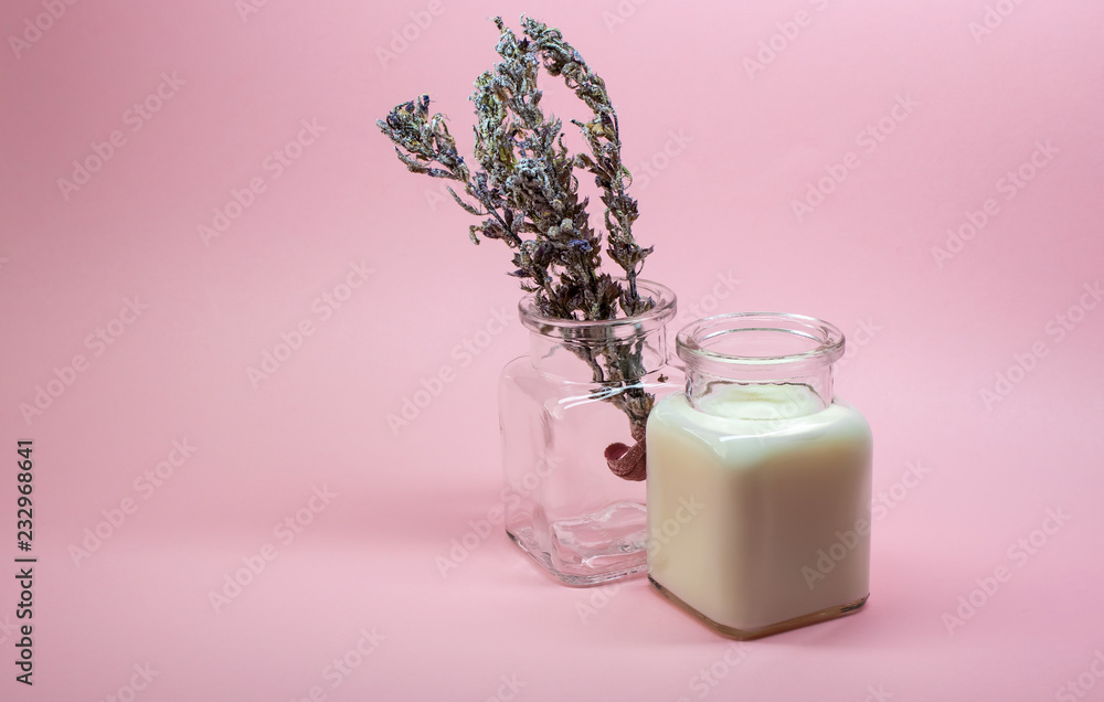 Milk and a sprig of snow-covered lavender. Milk and a sprig of snow-covered lavender.
