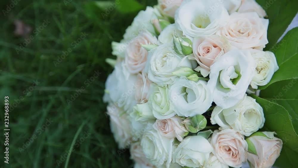 Beautiful wedding bouquet lies on the grass. Beautiful wedding bouquet lies on the grass.