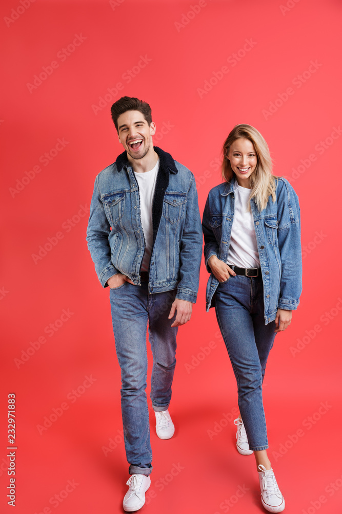 Fototapeta premium Full length portrait of a smiling young couple