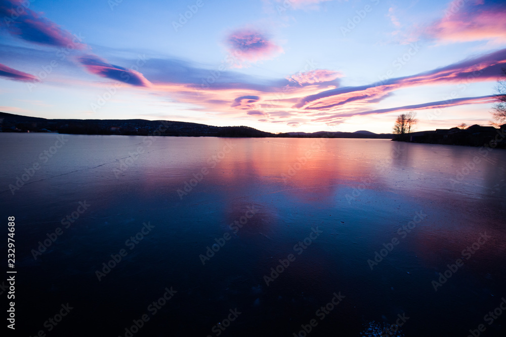 beautiful sunset at the frozen lake