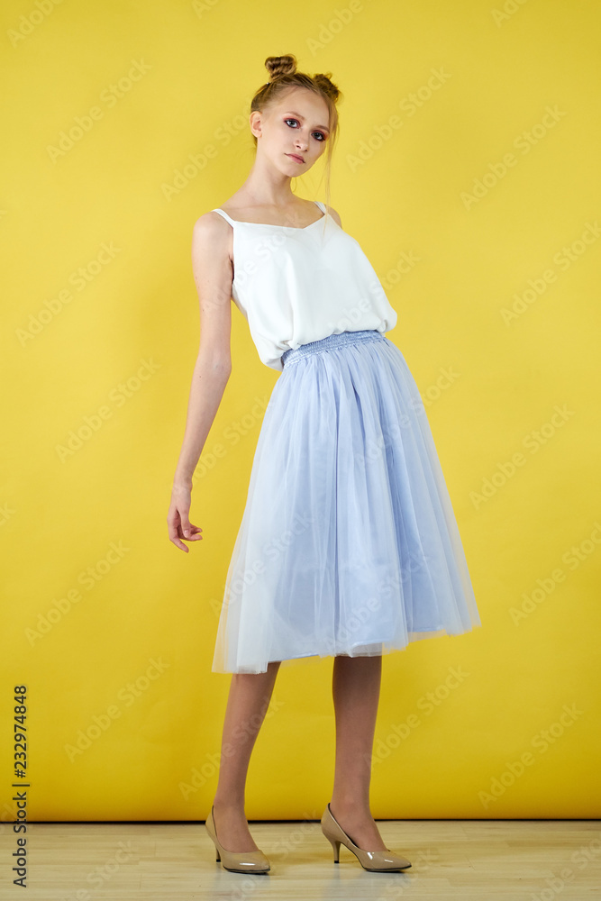 young girl on a yellow bright background. beautiful makeup, bright image, place for text young girl on a yellow bright background. beautiful makeup, bright image, place for text