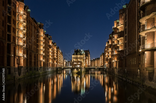 Hamburg Speicherstadt at blue hour. The blue sky and the color of the lights is a nice interaction. 