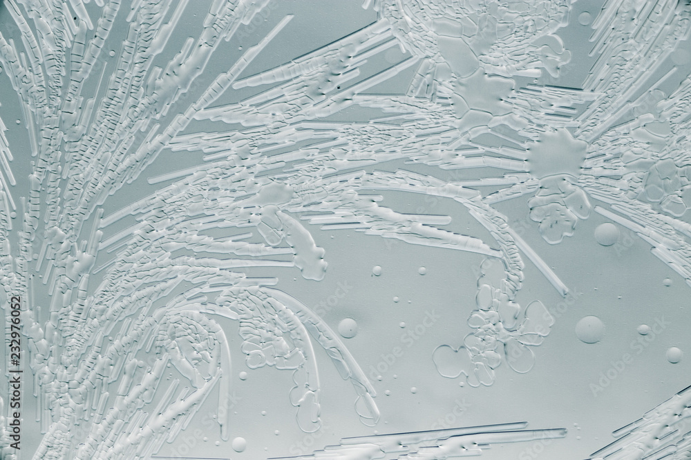 Snow patterns on glass as an abstract background Snow patterns on glass as an abstract background