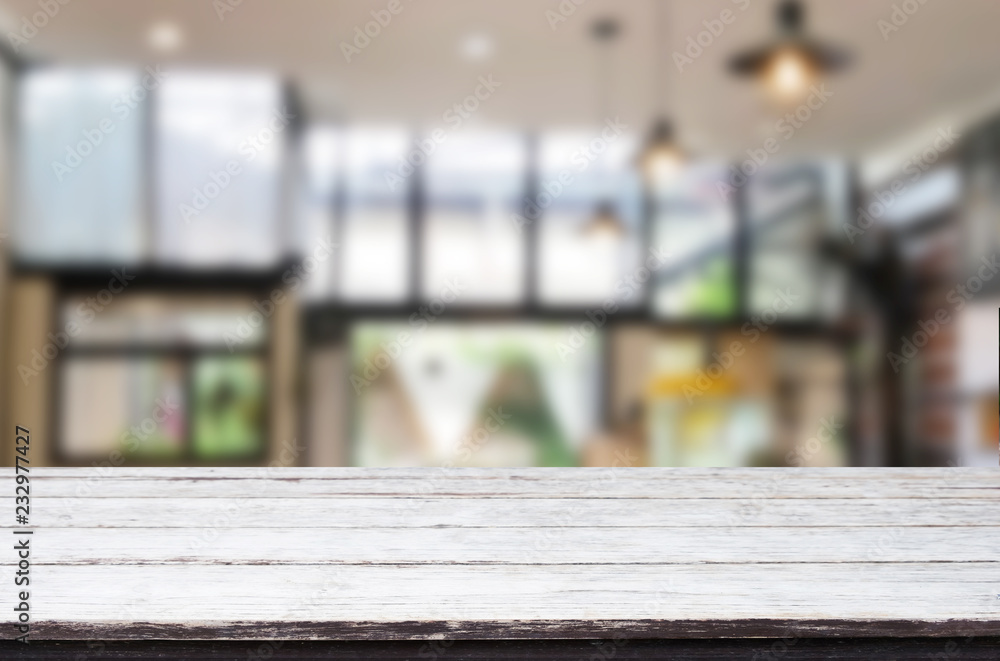 Wooden board empty Table Top And Blur Interior over blur in coffee shop Background, Mock up for display of product Wooden board empty Table Top And Blur Interior over blur in coffee shop Background, Mock up for display of product