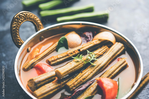 Drumstick Curry or Shevga sheng bhaji or south indian Sambar, served in a bowl over moody background. Selective focus photo