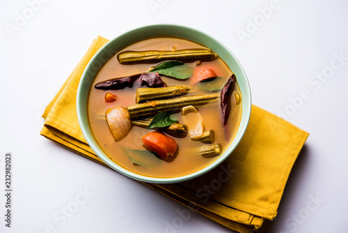 Drumstick Curry or Shevga sheng bhaji or south indian Sambar, served in a bowl over moody background. Selective focus photo