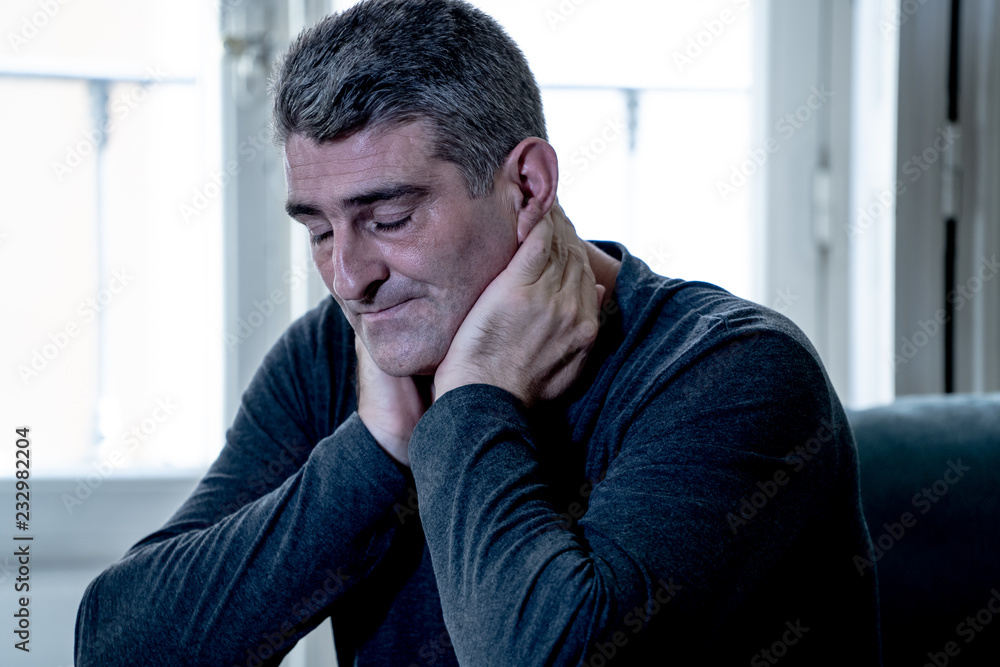 Fototapeta premium Depressed overwhelmed man feeling exhausted alone and unhappy