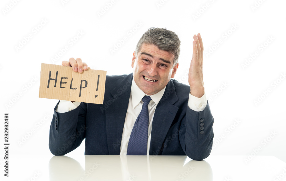 Mature businessman worried and desperate asking for help Mature businessman worried and desperate asking for help