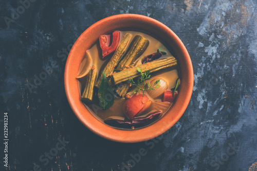 Drumstick Curry or Shevga sheng bhaji or south indian Sambar, served in a bowl over moody background. Selective focus photo