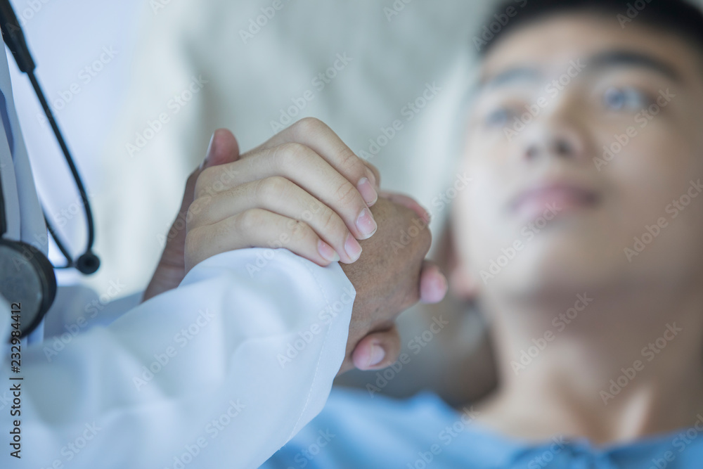 The doctor touches the hands of a patient in a hospital. Close up The doctor touches the hands of a patient in a hospital. Close up