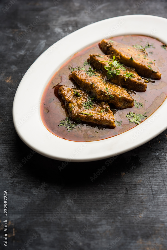 Patodi Rassa Bhaji or patwadi Sabji, a popular Maharashtrian spicy recipe served with Chapati and salad. Selective focus Patodi Rassa Bhaji or patwadi Sabji, a popular Maharashtrian spicy recipe served with Chapati and salad. Selective focus