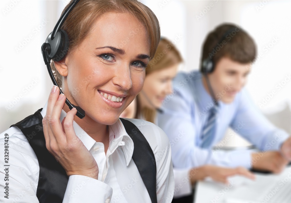 Young woman with headphones, call center or support concept Young woman with headphones, call center or support concept