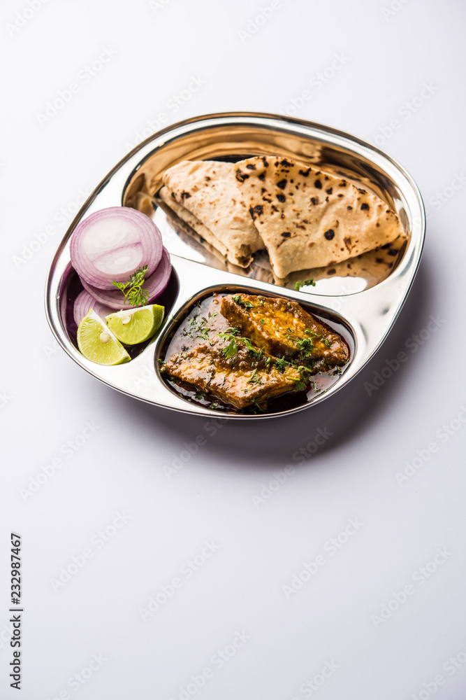 Patodi Rassa Bhaji or patwadi Sabji, a popular Maharashtrian spicy recipe served with Chapati and salad. Selective focus Patodi Rassa Bhaji or patwadi Sabji, a popular Maharashtrian spicy recipe served with Chapati and salad. Selective focus