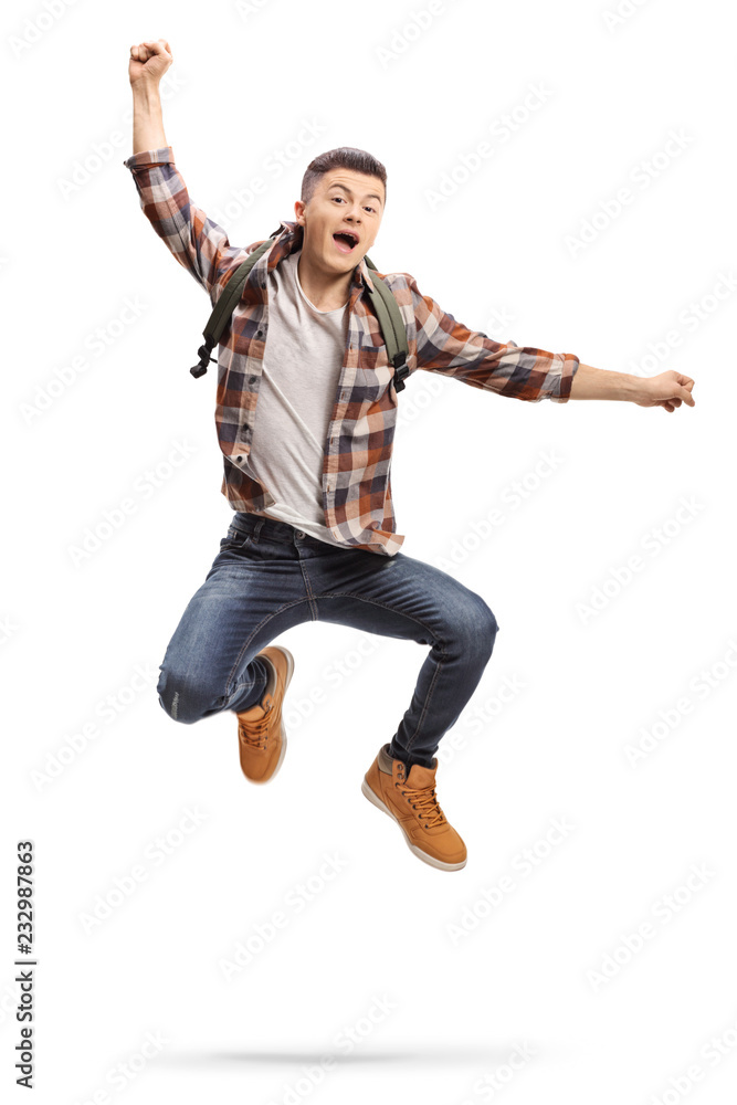 Joyful teenage student jumping