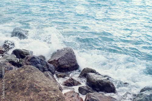 Sea landscape. Sea waves break against stones.