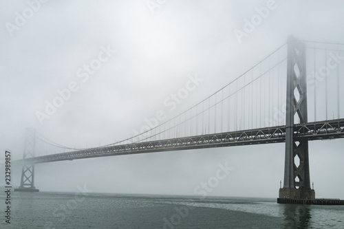 Foggy Bay bridge over river San Francisco