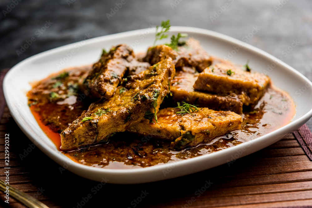 Patodi Rassa Bhaji or patwadi Sabji, a popular Maharashtrian spicy recipe served with Chapati and salad. Selective focus Patodi Rassa Bhaji or patwadi Sabji, a popular Maharashtrian spicy recipe served with Chapati and salad. Selective focus