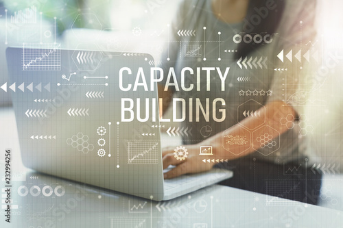 Capacity building with woman using her laptop in her home office