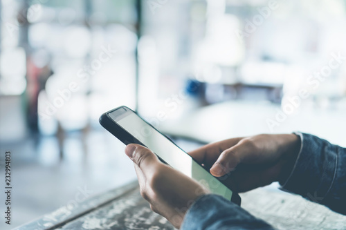 Woman hand using smartphone.