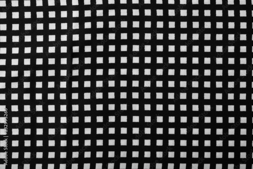 Fragment of black and white fabric. Plaid cotton fabric background Fragment of black and white fabric. Plaid cotton fabric background