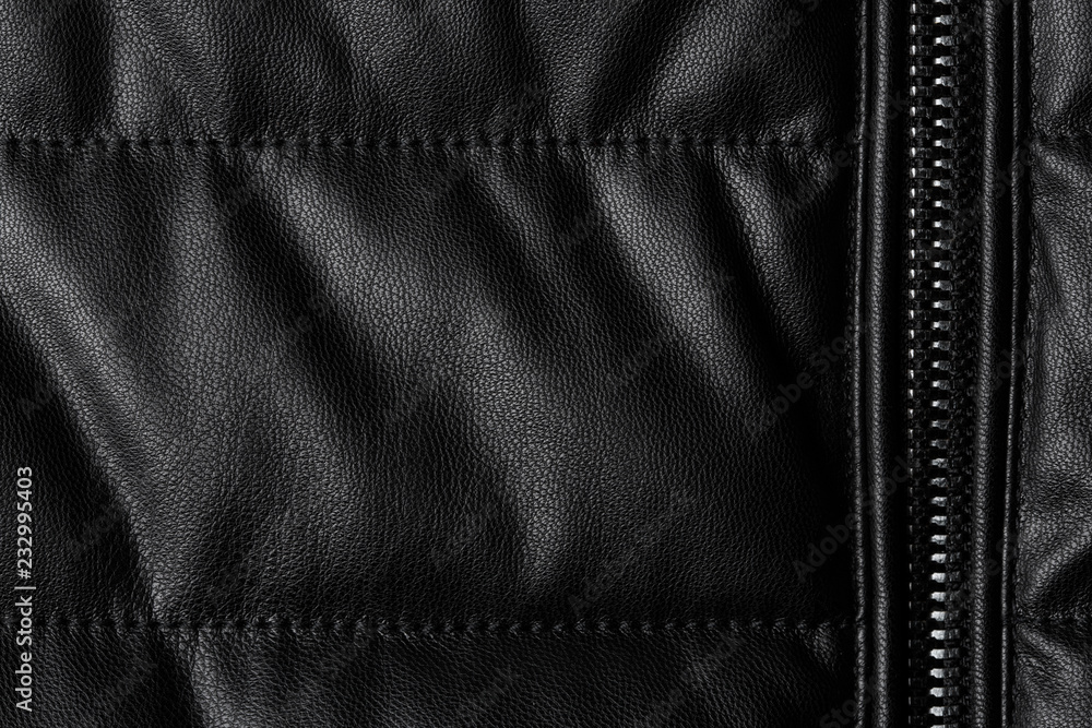 Black leather texture closeup as background. Jacket leather fabric texture. Black leather texture closeup as background. Jacket leather fabric texture.