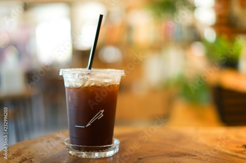 close up Iced americano with blur interior cafe background