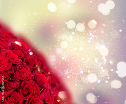 Bouquet of dark red rose buds with over bokeh fesive background photo